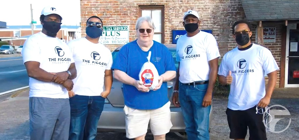 Figgers Foundation volunteers delivering a holiday turkey.